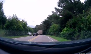 Driver Attempts Passing Truck on Blind Corner