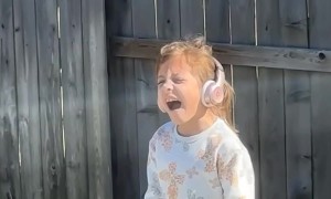 Girl Belts Out Wicked Song in Backyard