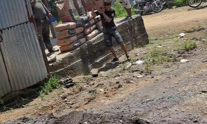 Boy Drops Bag of Sand