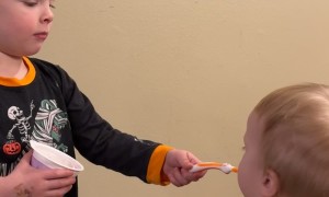 Feeding Little Brother Yogurt