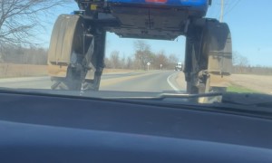 Guys Drive Under a Crop Sprayer