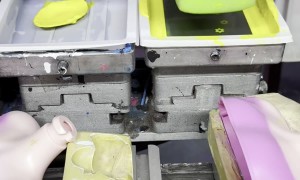 Doll Producer Paints On Blouse