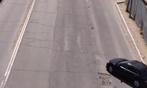 Civilian Fixes Hole in the Road