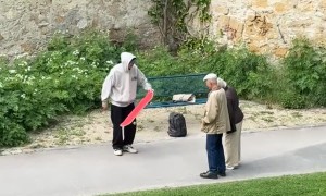 Skateboarder Explains Trick To Elderly Couple