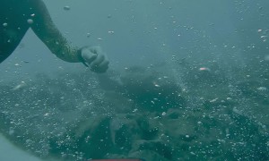 Gas Bubbles Escape From Underwater Cracks
