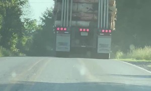 Lumber Truck Loses A Log