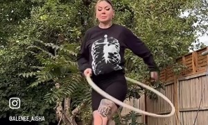 Woman Hanging on Her Hair and Hula Hooping