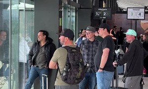 Dads Gather To Watch Airplane Tire Change