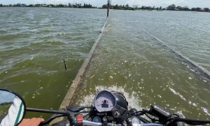 Flooded Road Blocks Way To School And Market