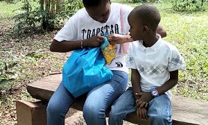 Monkey Snatches Chips From a Boy at a Park
