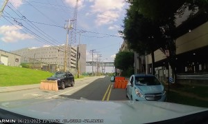 Oblivious Driver Pushes Parking Barrier With SUV