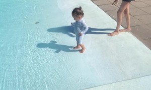 Baby's First Dip In the Pool