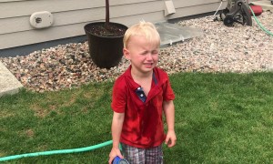 Three-Year-Old Keeps Spraying Himself With Water Hose