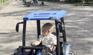 Girl Falls Asleep at the Wheel of a Toy Tractor