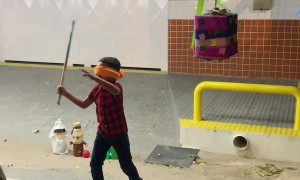 Blindfolded Son Struggles To Strike Pinata