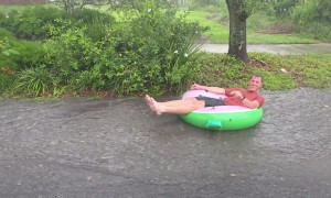 Florida Man Goes Tubing Down Rain-Drenched Street