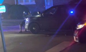 Man Dancing on a Chicago Police Vehicle