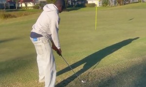 Friend Doubts Five Iron on Green