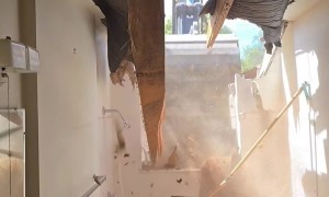 Excavator Bucket Bashes Hole in Bathroom Wall