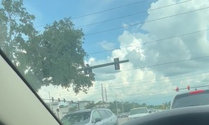 Driver Pulls Into Oncoming Lane at Intersection