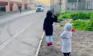 Cheerleaders for Dad Running a Race