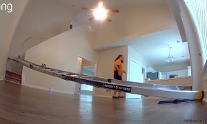 Ring Cam Captures Contractor Slips and Slides Down Stair Railing Like a Human Log