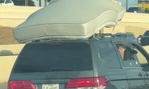 Car Doesn't Pull Over With a Mattress Barely Hanging On