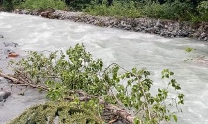 Crossing A River In The Arkhyz Mountains