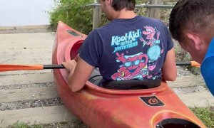 Entering the River via Pushing a Kayak Down the Stairs