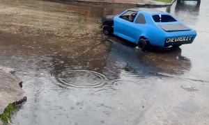 Miniature Car Goes For Rainy Cruise