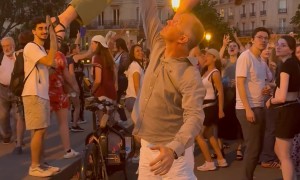 Couple Performs an Impressive Lift at Music Festival