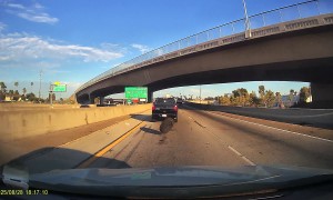 Runaway Spare Tire Narrowly Misses Car
