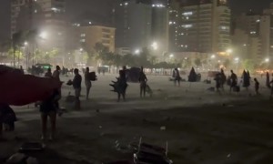 Sudden Surge of Wind Takes Beachgoers by Surprise