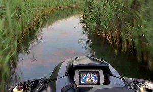 Jet Skiing Through a Marsh at Sunset