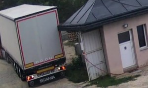 Truck Driver Hits Roof of Storage Space