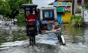 Lifted Autorickshaw Drives Through Floodwater