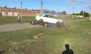 Car's Barrel Tower Topples Over