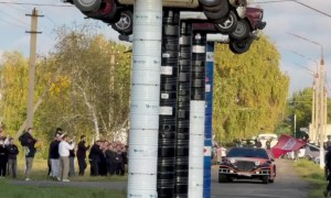 Old Limousine Rams Stacked Barrels With Vintage Soviet Cars on Top