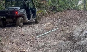 Trail Sodas Spill From Tipped Side-By-Side
