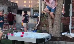 Drunk Man Jumps Through Air Hockey Table