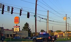 Rolling Coal Next to Cop Car