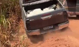 Truck Gets Stuck on Narrow Dirt Road Going Around Semi