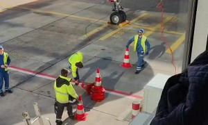 Airport Workers Play With Traffic Cones