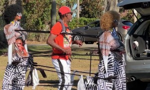 Man Has Puppet Back Up Dancers