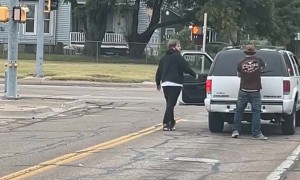 Two Men Spotted Fighting at a Stoplight