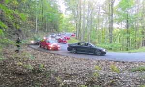 Sports Car Drifts Over Line, Hits Moving Truck