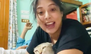Woman Aggressively Kisses Her Cat