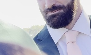 Best Man Fights To Not Laugh While Priest Sings in Prayer