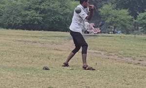 Man Falls While Throwing a Shot Put Ball