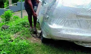 Shrink Wrapping Car To Protect From Hurricane Mellissa